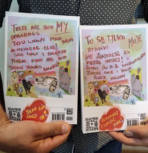 a man holding two books with a message