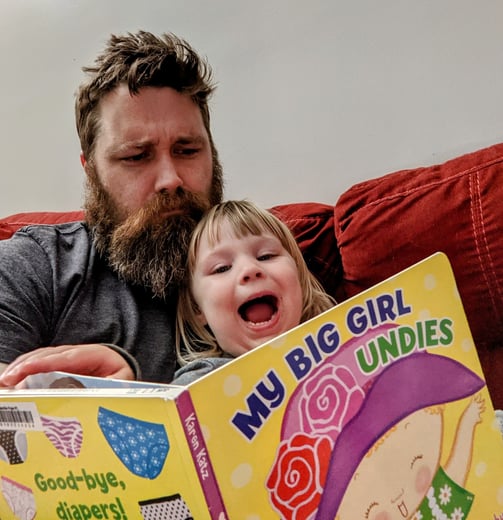 My toddler and I reading a book called My Big Girl Undies. My daughter looks jazzed, but I am studying intensely. 