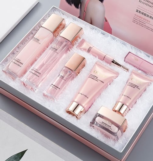 a box of beauty products including a perfume and a perfume bottle