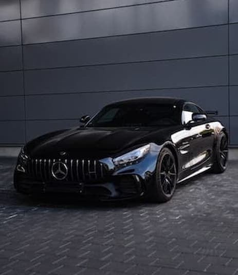 Black sports car detailed with mirror finish and full paint restoration
