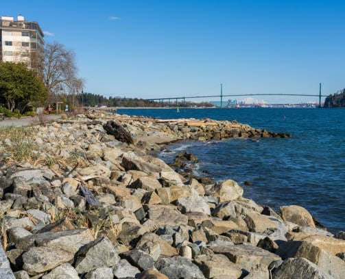 coastal seawall with bridge in horizon