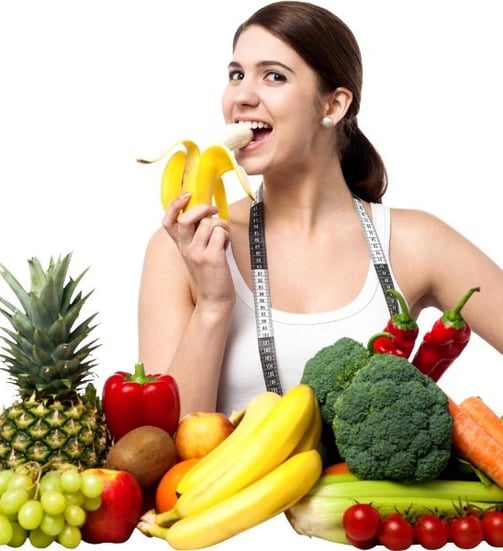 woman eating colorful fruits