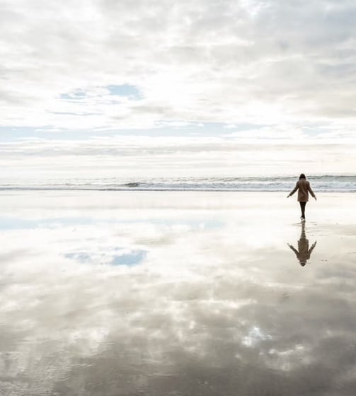 a person walking on a beach with your soul