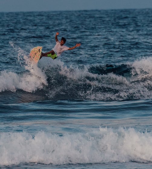 a man is surfing on a wave in the ocean