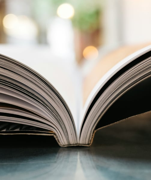 a book opened to show a book with a bookmark