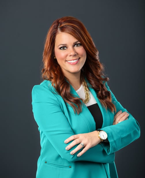 kate in a blue blazer and black pants