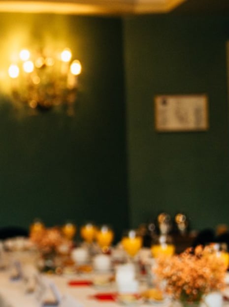 a table with a bunch of plates of food and drinks