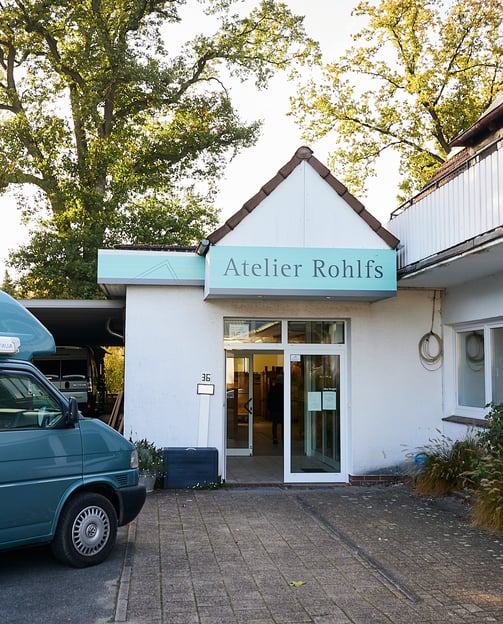 a van parked in front of a building, atelier rohlfs, frameworke