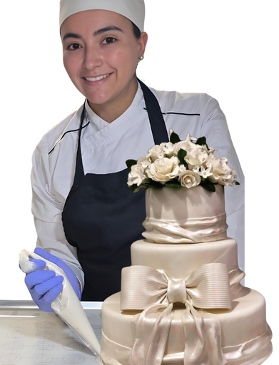 Natalia smiling while holding a beautifully decorated cake, showcasing her artisanal baking skills.