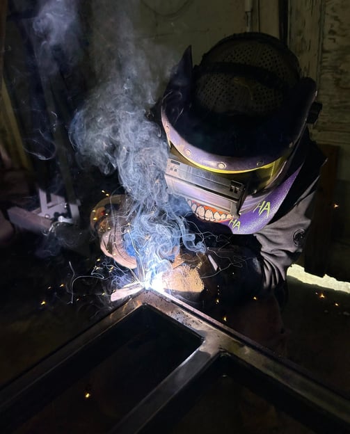 a man welding a peice of metal