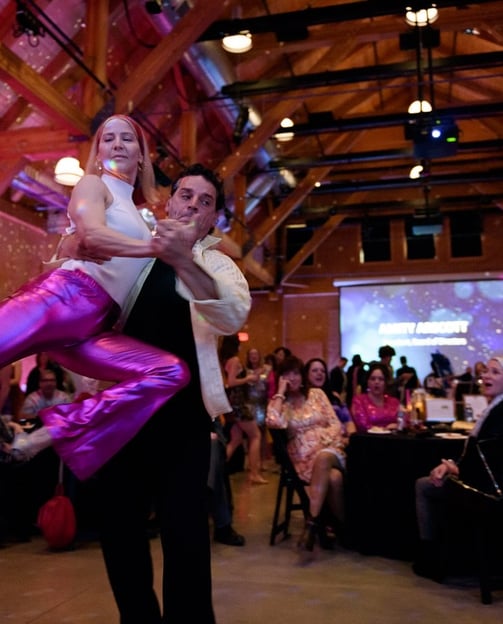 Mekhael Srour and Martha Slater dancing 80's night