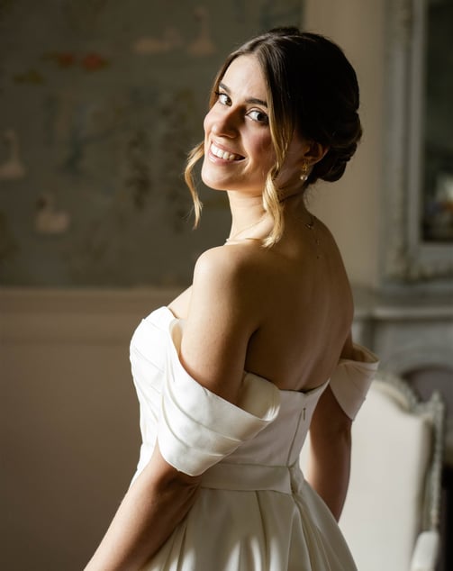 A bride smiling just after getting ready - Editorial, fine art photography