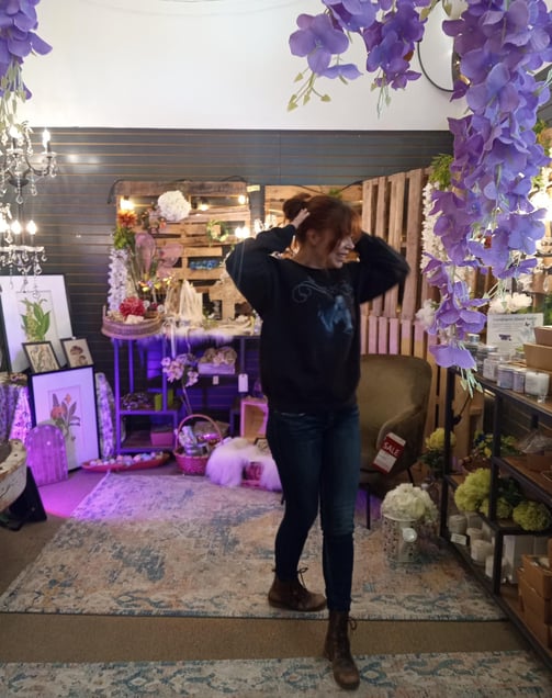 Maddy Fay Robinson hangs in the Fairy section of decor warehouses
