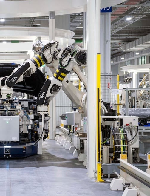 Robotic arms on an assembly line.