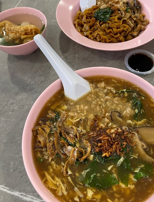 Pan mee, or hand pulled noodles in a gravy sauce and fried anchovies on top