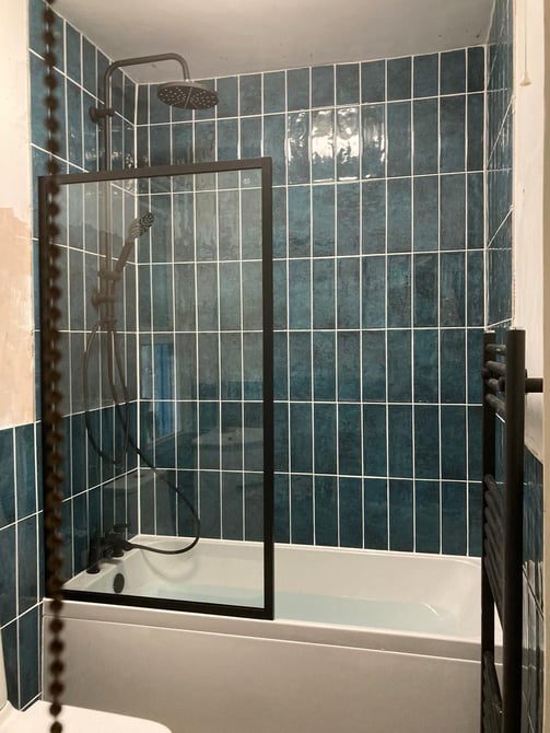 green tiles with black frame glass shower screen - installed by Rupert De La Mare