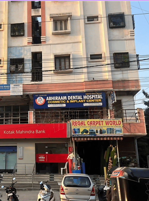 a building with a lot of people walking around dental hospital