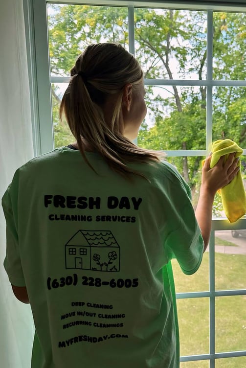 a woman cleaning a window