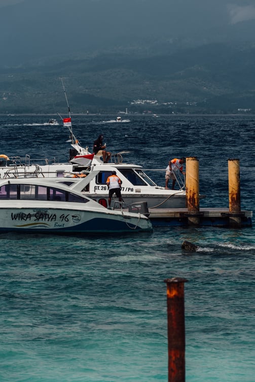 a boat with people on it in the ocean