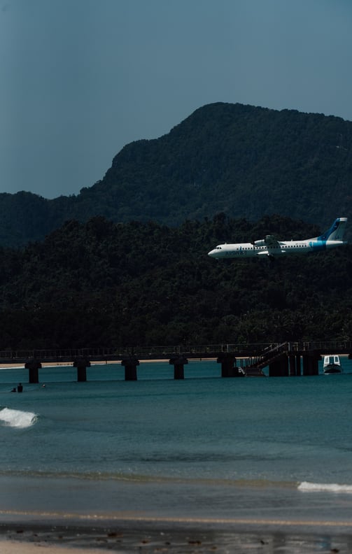 a plane taking off from a beach