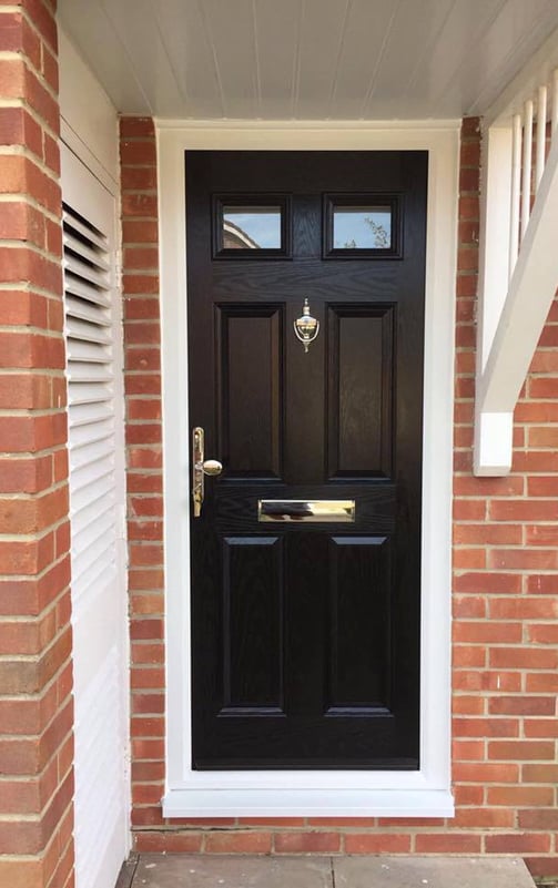 a black front door on red brick house which was fitted by Buildmydoor in Gosport