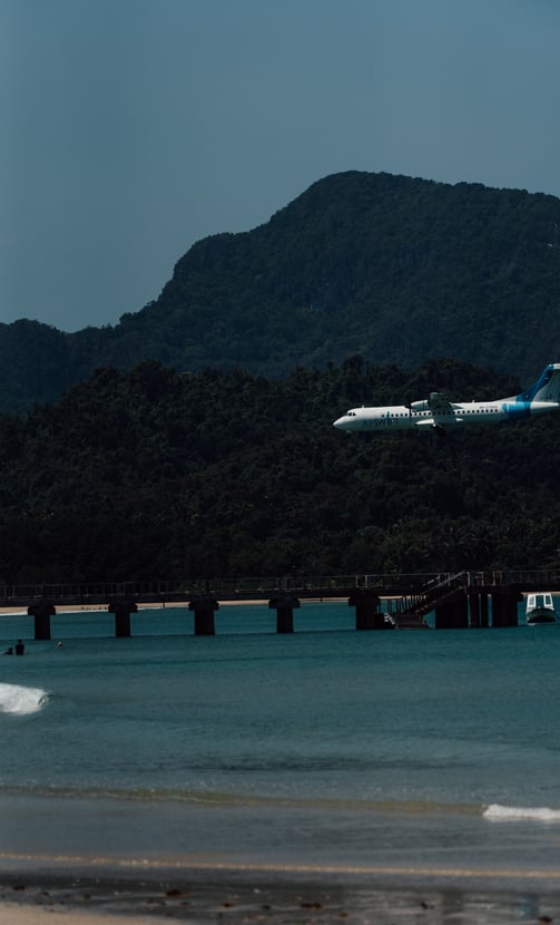 a plane taking off from a beach
