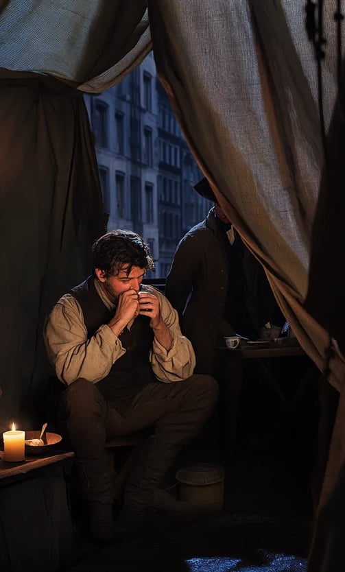 Sword swallower rests backstage after 1817 New York performance.