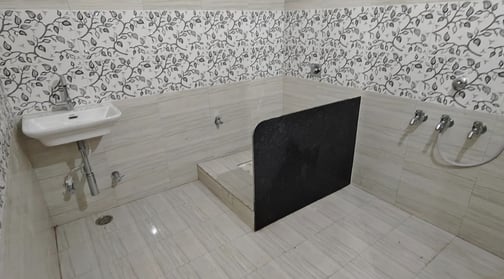 a bathroom with a shower and toilet