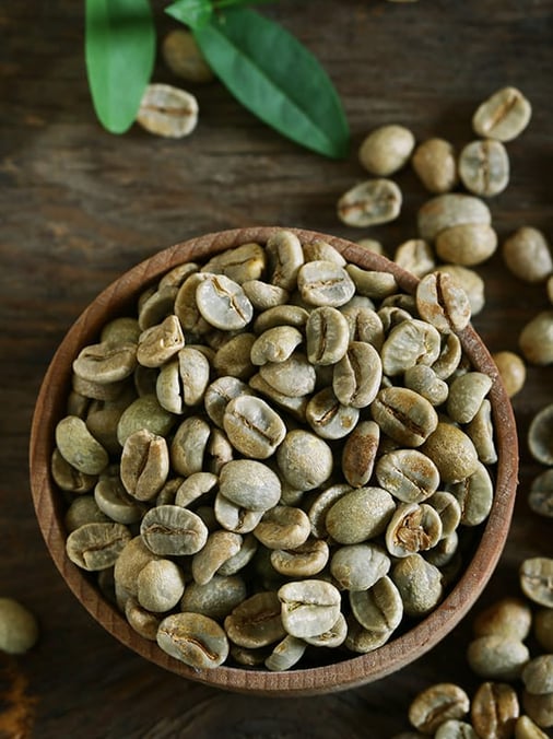 a bowl of coffee beans and a bowl of coffee beans