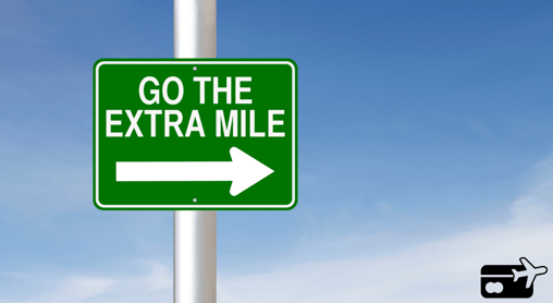 a green sign with a white arrow pointing to the left