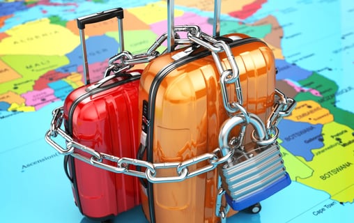 a group of luggage bags with luggage on a map of the world