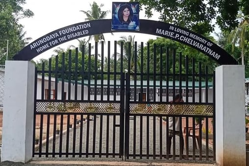a gated entrance to a building with a sign that says,'welcome to