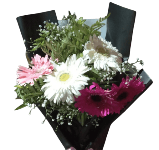 a bouquet of flowers in a vase on a black background