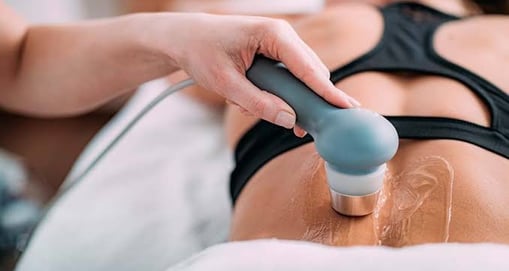 UST, TENS machine applied on lower back for pain management.