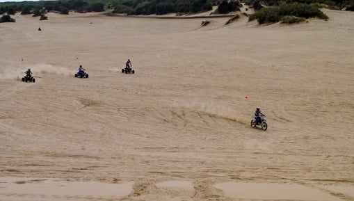 Oregon Coast -People on atv's & motorcycles on Winchester Bay's sand dunes