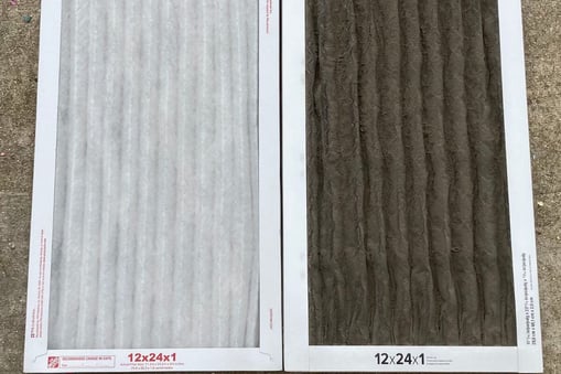 Side-by-side comparison of a clean and dirty 12x24x1 air filter on concrete surface