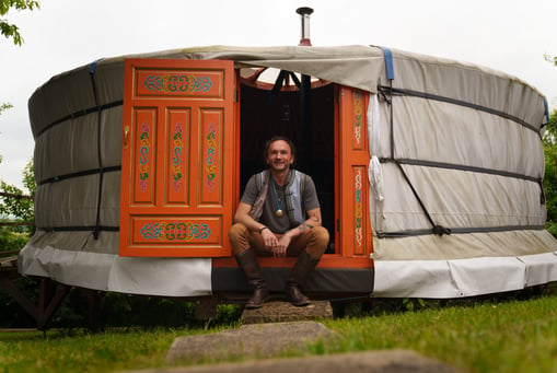 a man sitting in a yurty yurty yurty yurt