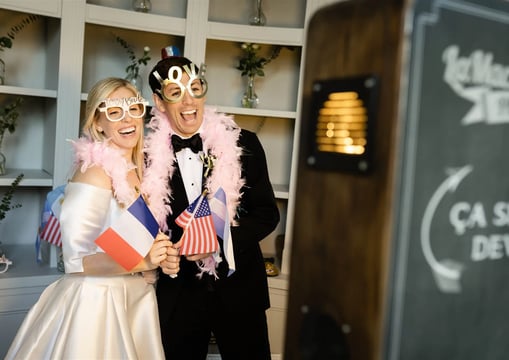 Bride and her borther enjoying photobooth during elegant Provence wedding