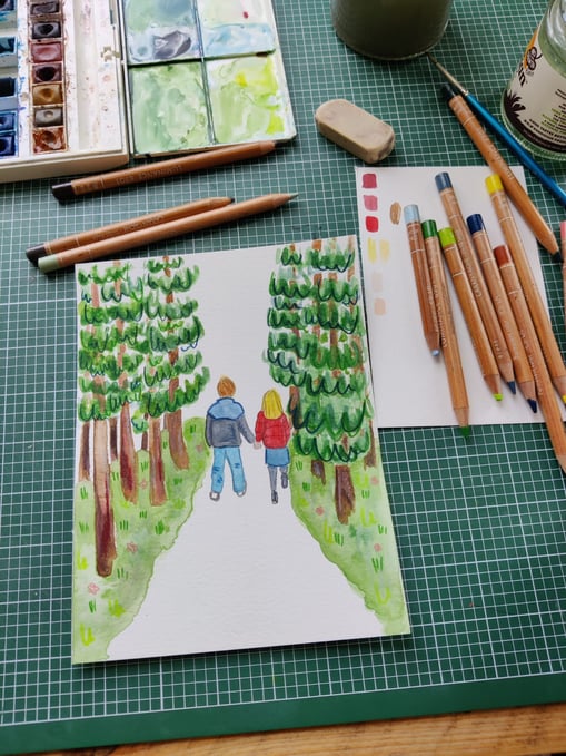a work in progress picture of a watercolour painting of a couple walking in the woods