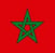 The flag of Morocco, featuring a red background with a green five-pointed star in the center. The te