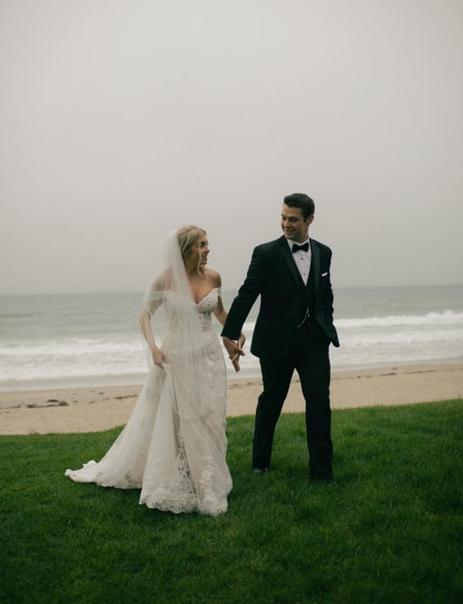 Bride and groom walking on the beach in Wells Beach Maine