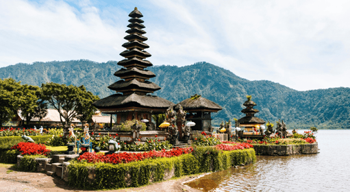 a small island with a pagoda in the middle of it in Bali, Indonesia