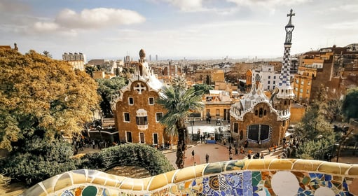 a view of a park Guell with a view of a city in Barcelona, Spain