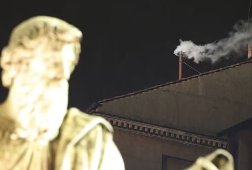 a statue of a man with a pipe smoking a pipe