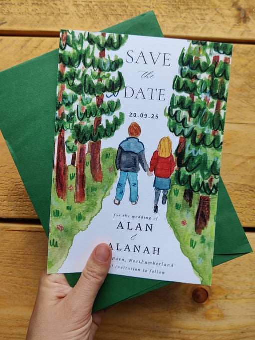 a save the date of a couple walking in the woods