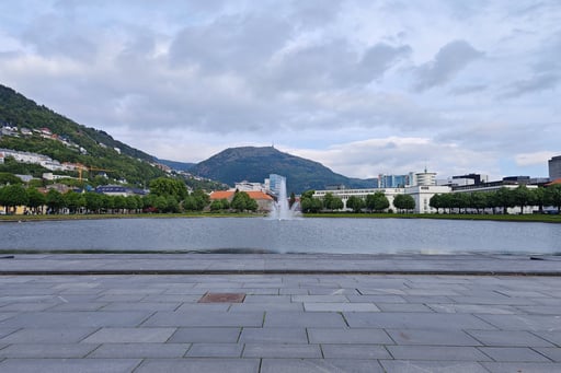 View of waterfall and lake in Byparken Bergen Norway
