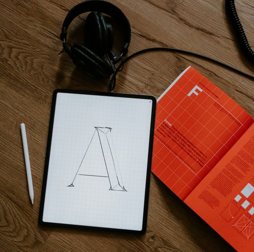 a tablet with a tablet and headphones on a table