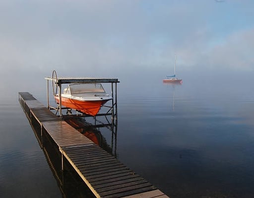 boat lift with red and white boats