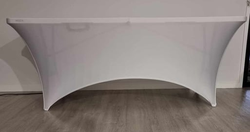 Lifetime 6ft folding table with white spandex cover, available for hire in Brisbane.