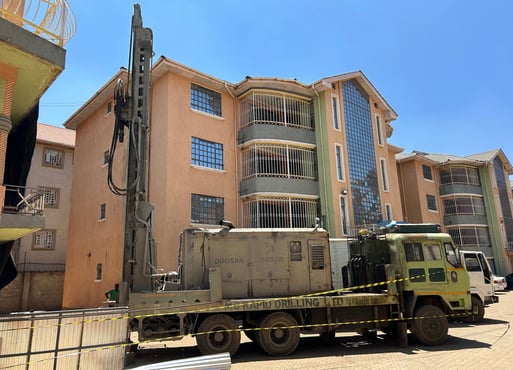 a truck with a crane on it's side and a crane on the other